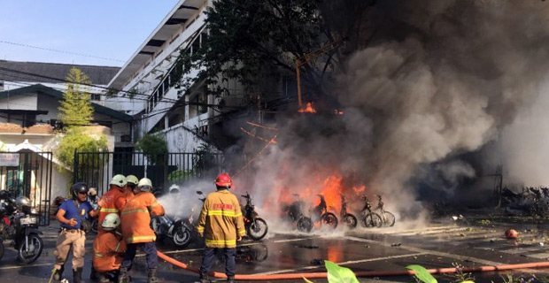 Family brings 8-year-old daughter to suicide bombing launched on police HQ