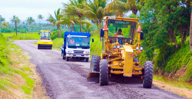 Fulton Hogan Highways clears water channels and builds pavement along Wainidova Road, Navua