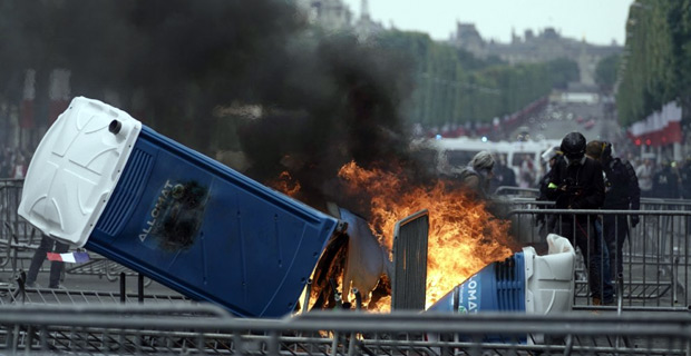 Police fire tear gas at protesters after France's annual Bastille Day military parade