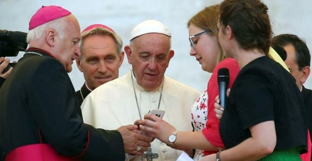 Pope Francis calls for people to put away mobile phones at the dinner table and get talking