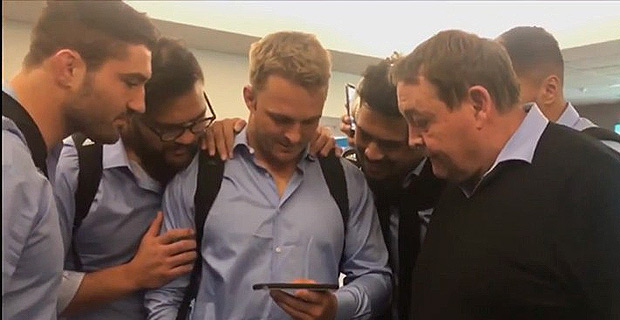 All Blacks and Hansen huddle around tiny phone to watch moment Silver Ferns win World Cup