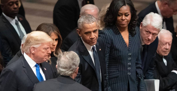 Trump, seated among his enemies, brings tension to George H W Bush's funeral
