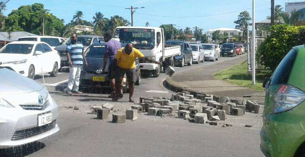 Students escape injuries as unsecured concrete blocks fell of a delivery truck