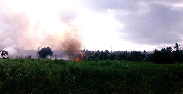 Firefighters control grass fire from spreading to houses in Nadawa