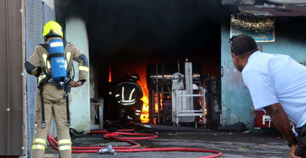 Firefighters are working to contain a fire at CWM Laundry room