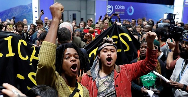 Environmentalists and observers barred from UN climate talks after protest inside the conference