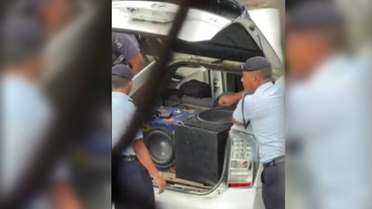 Police officers search vehicle along Harris Road in Suva