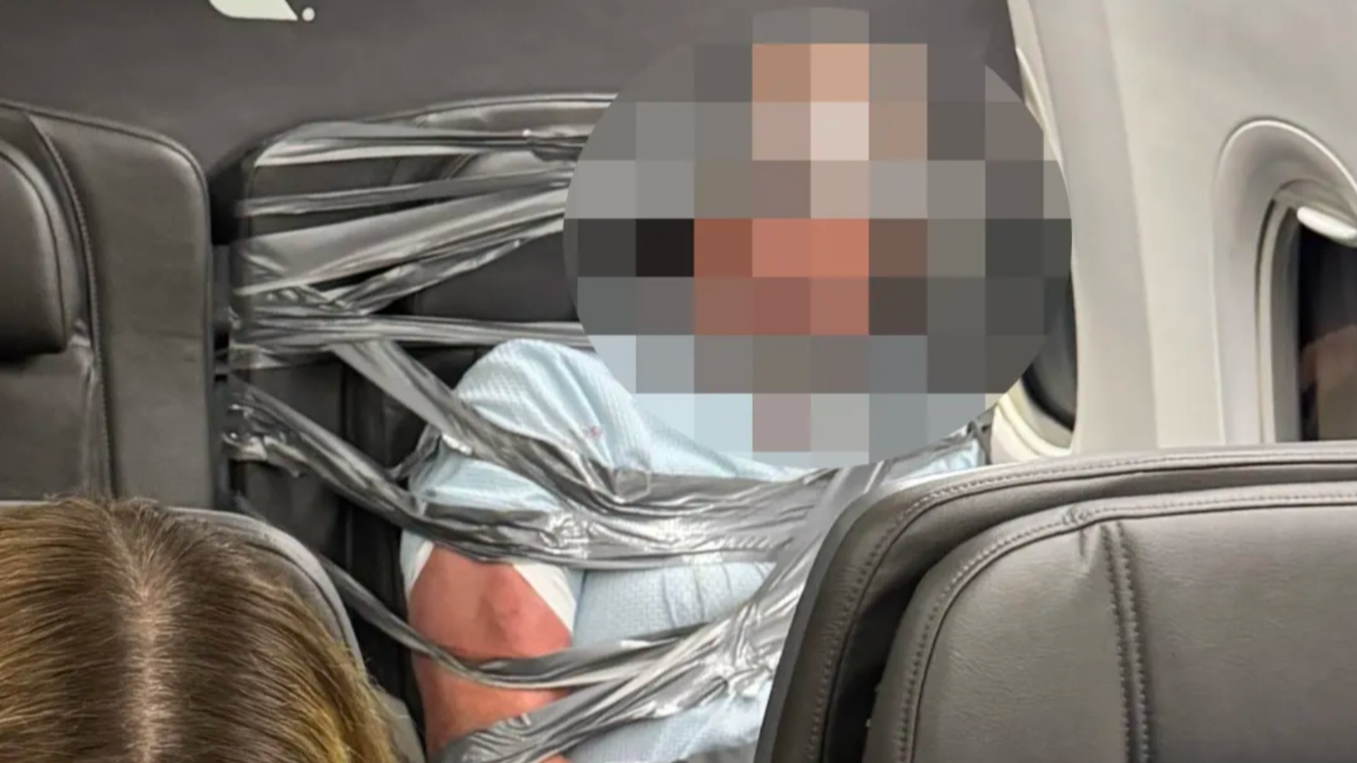 Disruptive passenger restrained with duct tape as US flight makes emergency landing