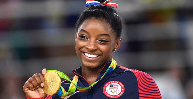 Four‑time Olympic champion says she was abused by former USA gymnastics sports doctor