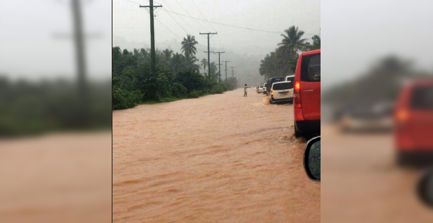 The Queens Highway past Naboutini reduced to a single lane due to surface flooding