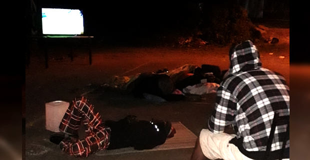 Tuwai's friends and family gather at their famous roundabout to cheer the team on all night