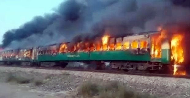 Train travelling in Pakistan catches fire mid journey killing at least 74 people
