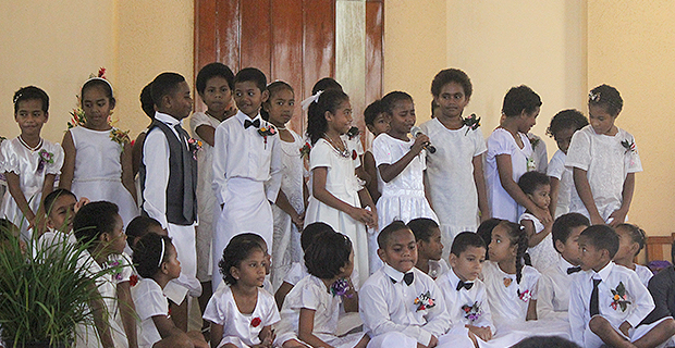 Children take center stage to commemorate Palm Sunday