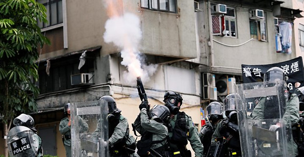 Hong Kong police fire tear gas at an unauthorized protest