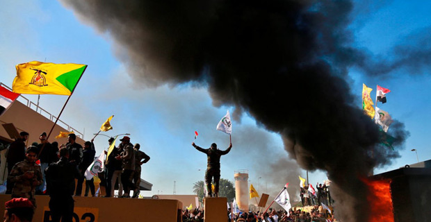 Protesters angered by recent US airstrikes attack America embassy compound in Baghdad