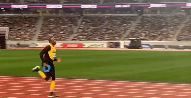 Usain Bolt takes to the track of newly completed National Stadium in Tokyo