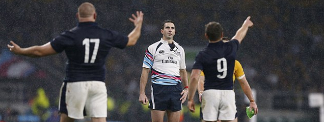 Referee almost hit by a bottle thrown from crowd