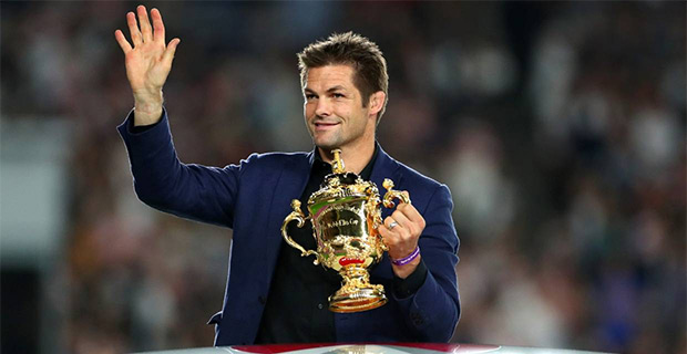 Former All Blacks captain Richie McCaw hands over Webb Ellis Cup