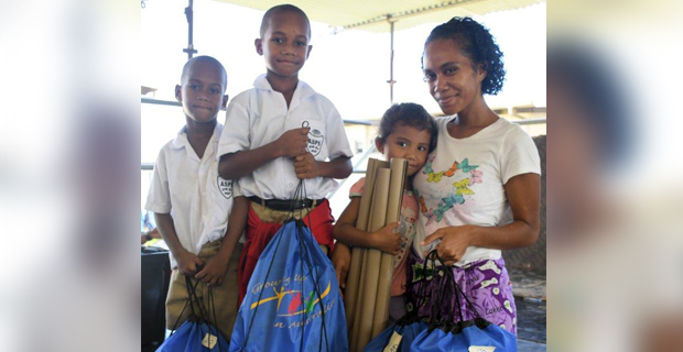 Parents and children in squatter settlements provided with school essentials