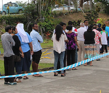 Members of the Public line up early this morning to cast votes