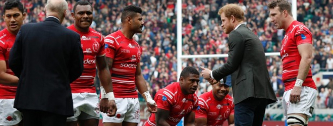Fijian players kneel before Prince Harry in Army-Navy rugby match