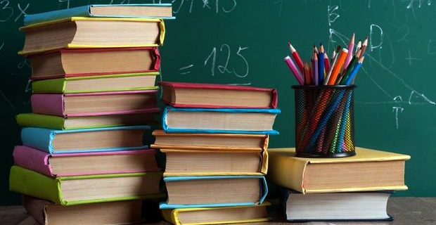 Students of Koroipita Settlement receive school bags and books from FENC Fiji