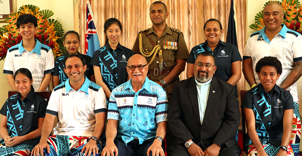 Team Fiji to the Youth Olympic Games presents i‑Tatau to President Jioji Konrote