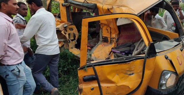 Train hits school van in India killing 12