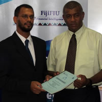 FIU/Ministry Sign MOU