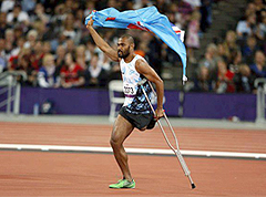 Delana celebrates gold medal by running around track