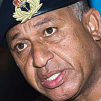 Interim PM defends Dec 5th takeover